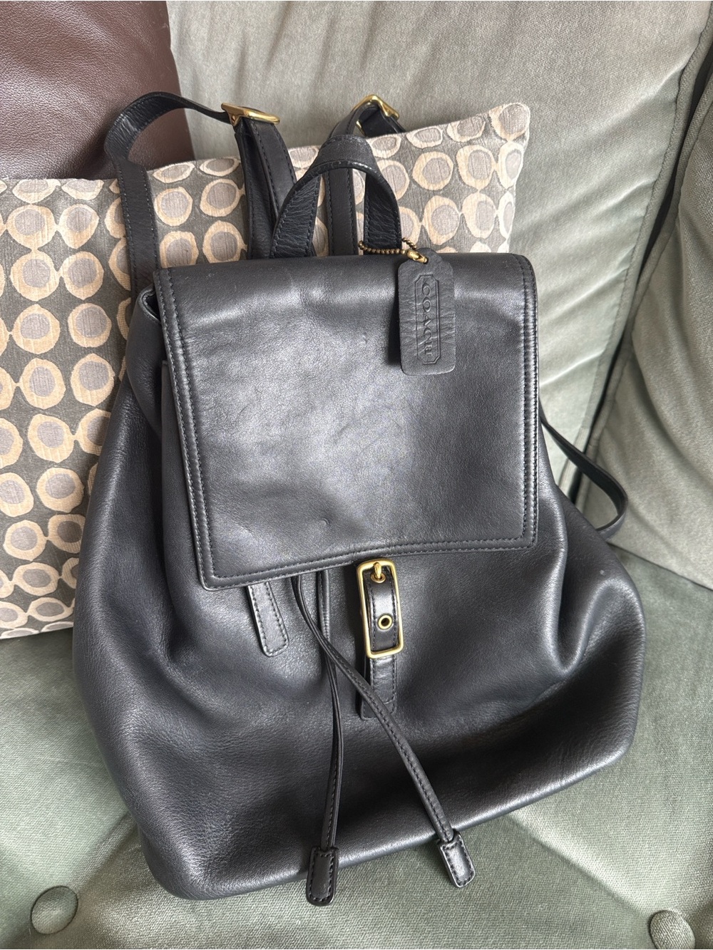 Coach Black Leather Flap Drawstring Backpack with Gold-Tone Hardware